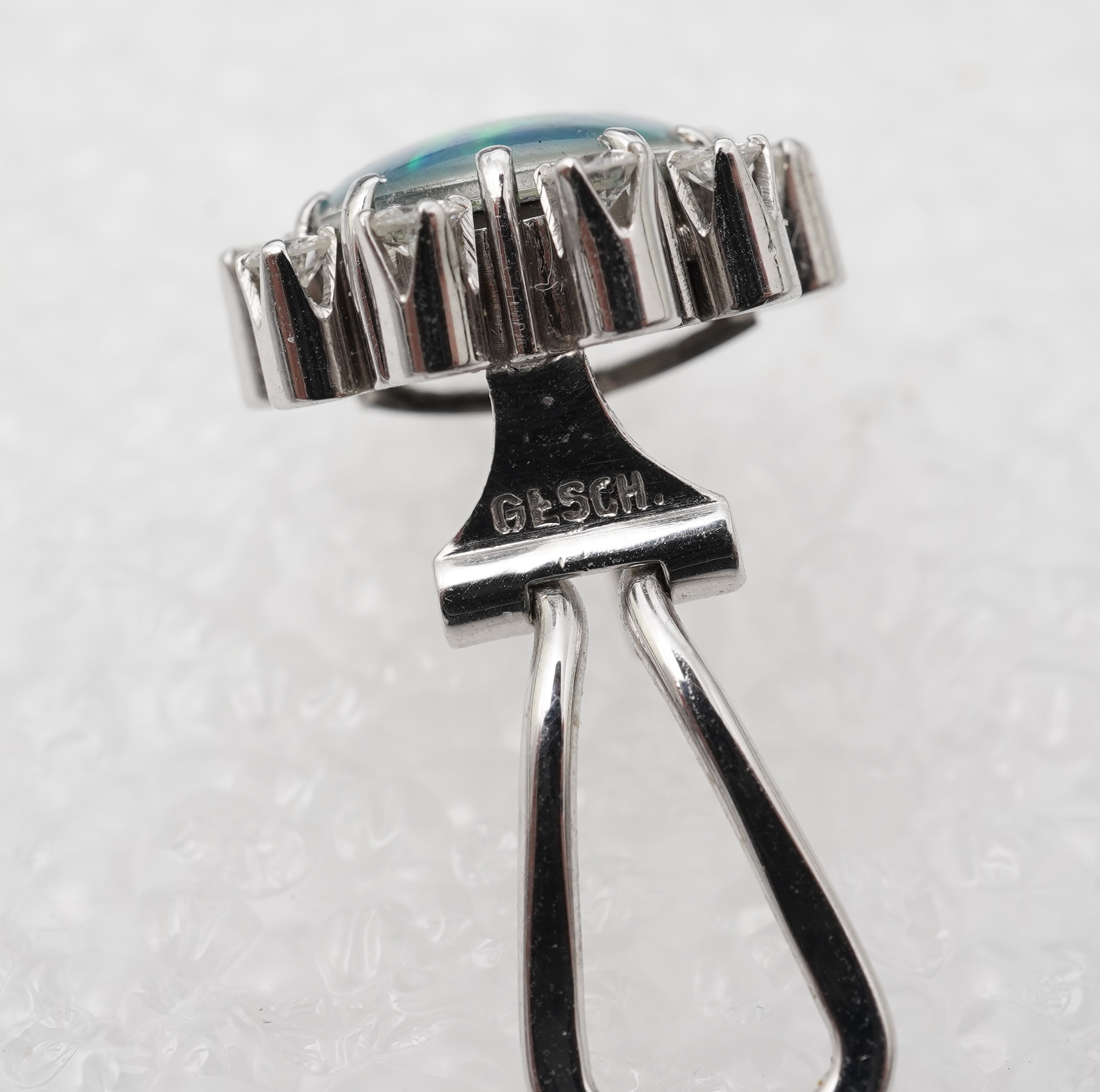 A pair of opal triplet and diamond earrings